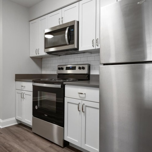 a kitchen with white cabinets